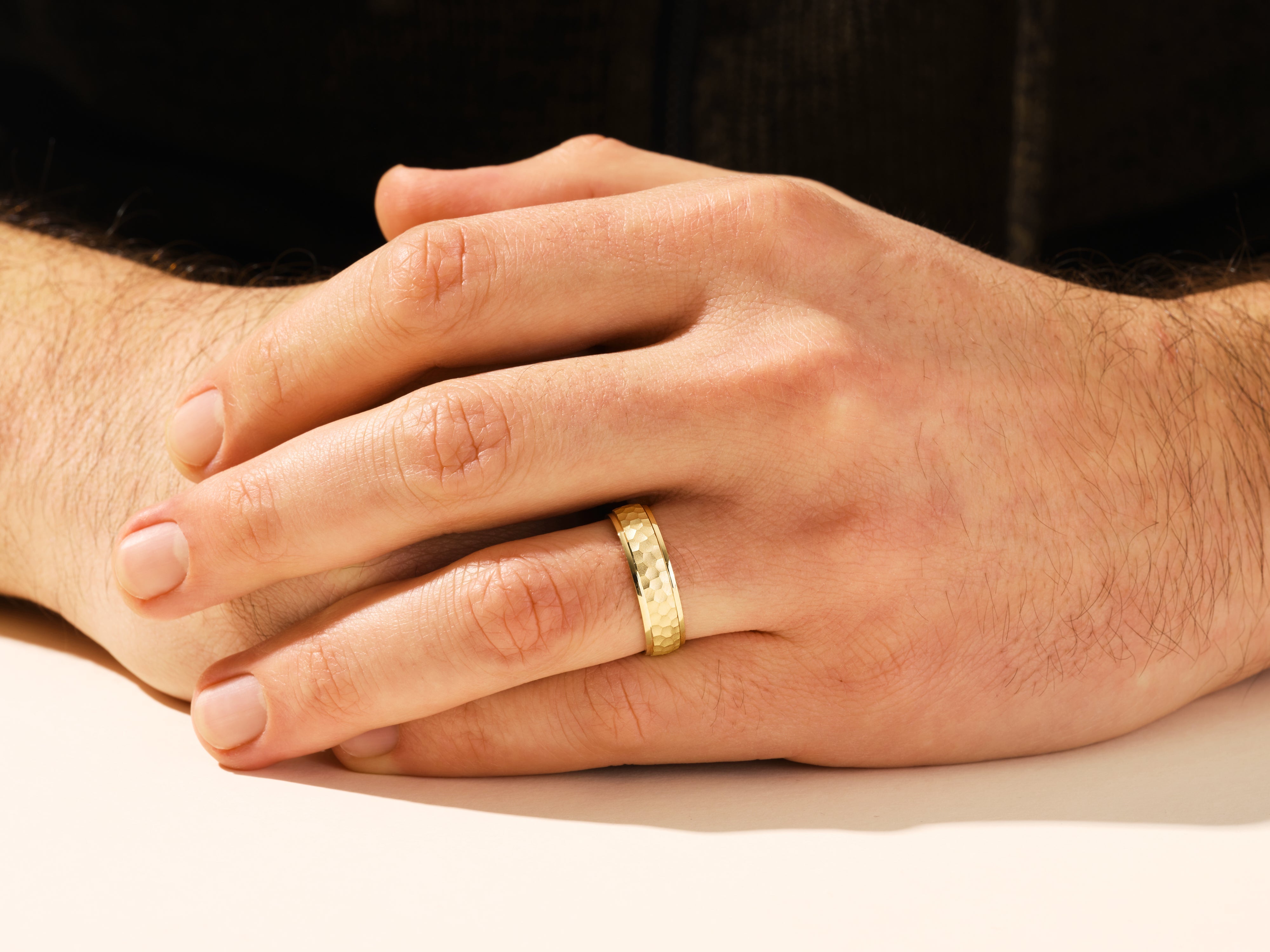 Gold hammered ring on a man's hand, jewelry for men