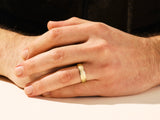 Gold hammered ring on a man's hand, jewelry for men