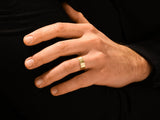 Gold wedding band on a man's finger, jewelry for him