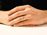 Gold diamond ring on a man's hand, jewelry product