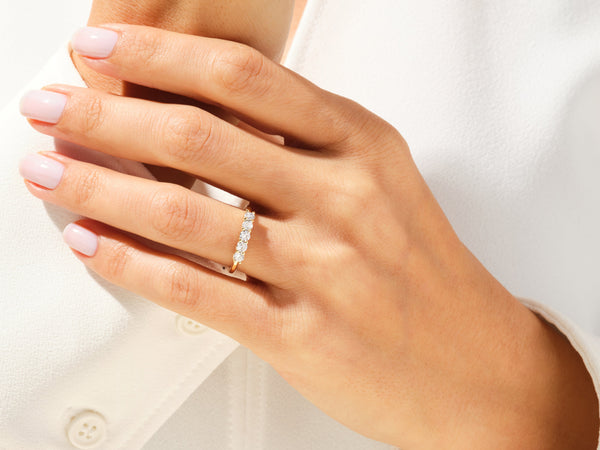 Diamond band ring on a woman's hand, fine jewelry