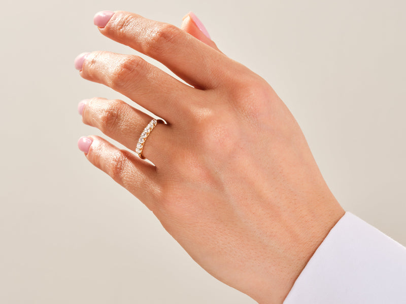 Diamond band ring on a woman's hand, luxury jewelry