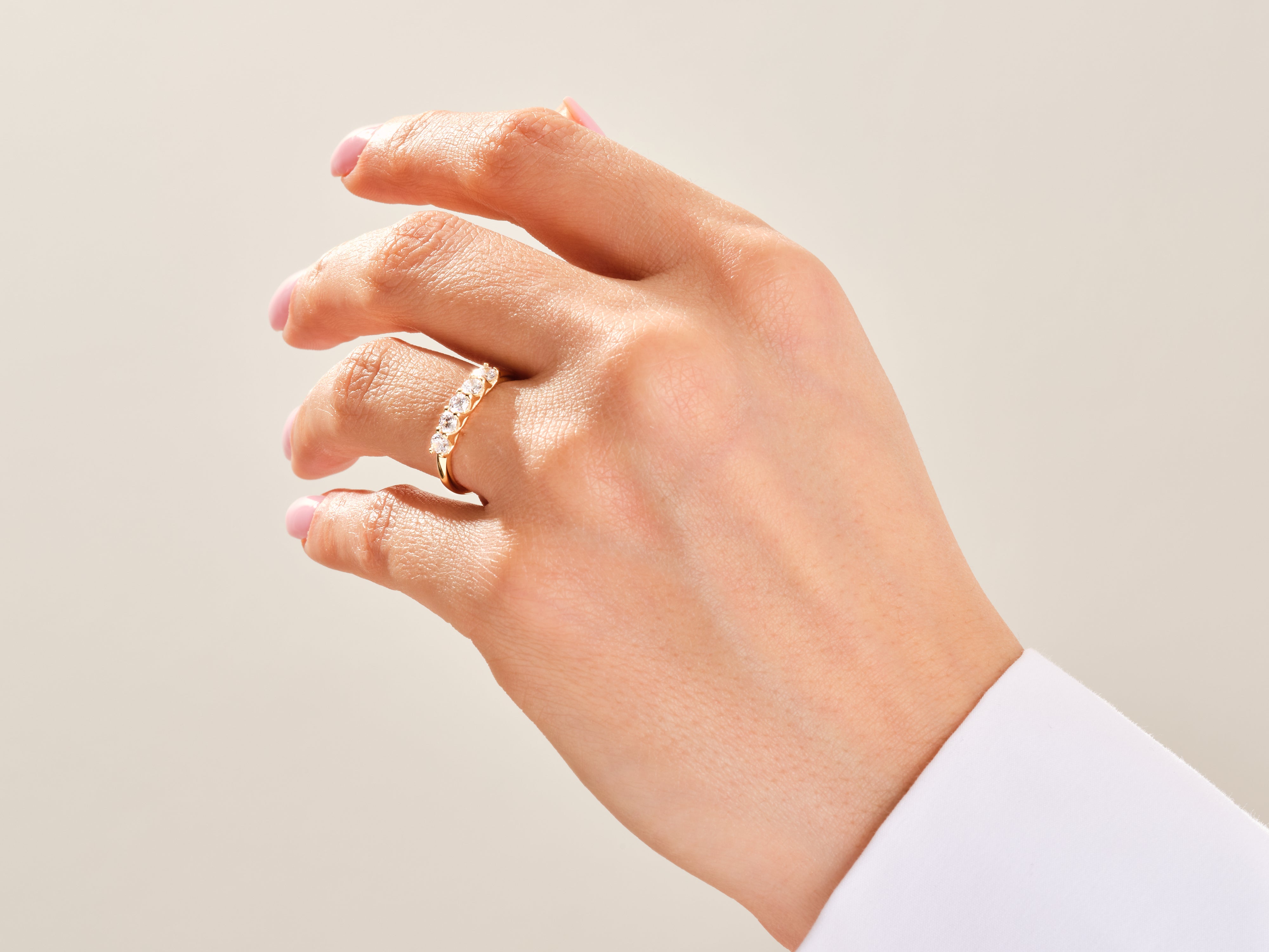 Diamond band ring on a woman's hand, fine jewelry for sale