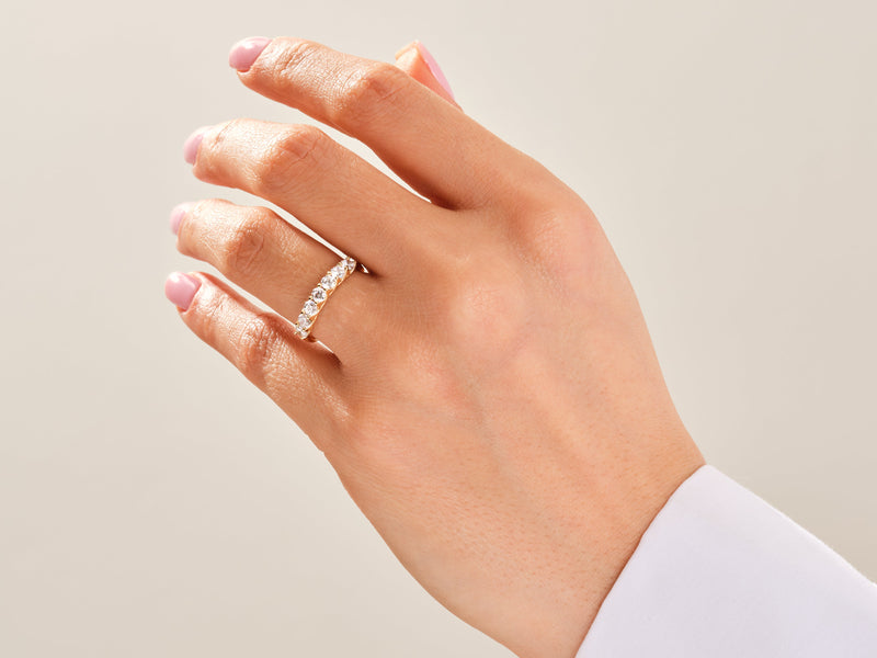 Diamond eternity ring on a woman's hand, fine jewelry