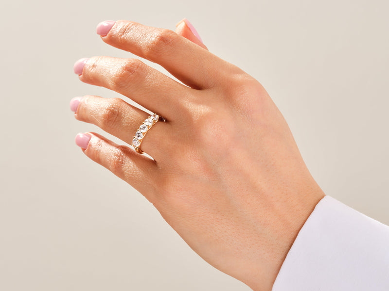 Gold diamond band ring on a woman's hand