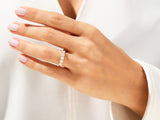 Diamond eternity ring on a woman's hand, jewelry photography