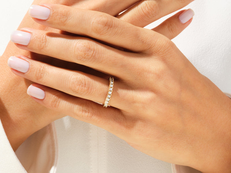 Diamond eternity ring on a woman's hand, jewelry photography