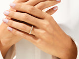 Diamond eternity ring on a woman's hand, fine jewelry