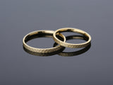 Hammered gold wedding bands from jewelry firm