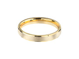 Gold wedding band with brushed finish and polished edges