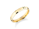 Gold wedding band with beveled edges and polished finish