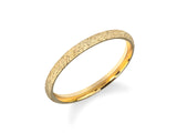 Textured gold band ring from jewelry collection