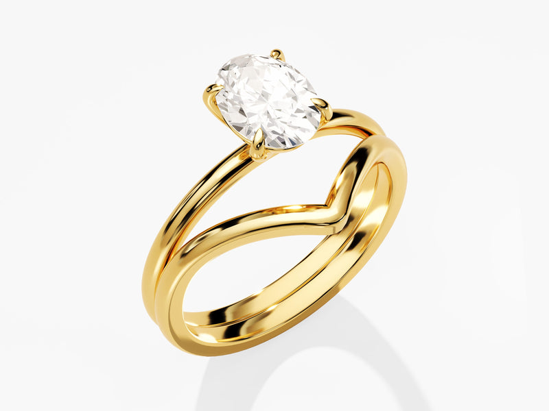 Gold oval diamond engagement ring with chevron band