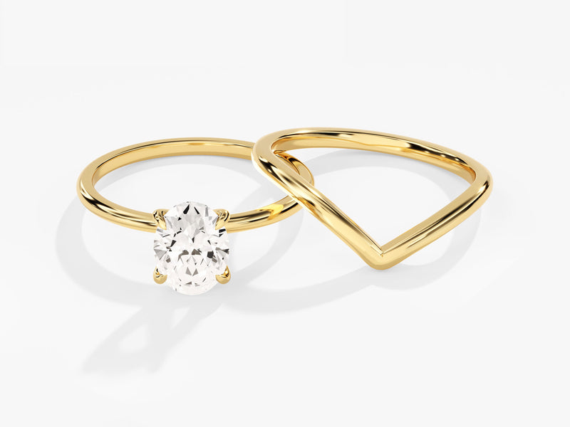 Gold oval diamond engagement ring and wedding band set