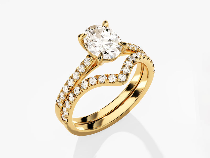 Gold oval diamond engagement ring and wedding band set