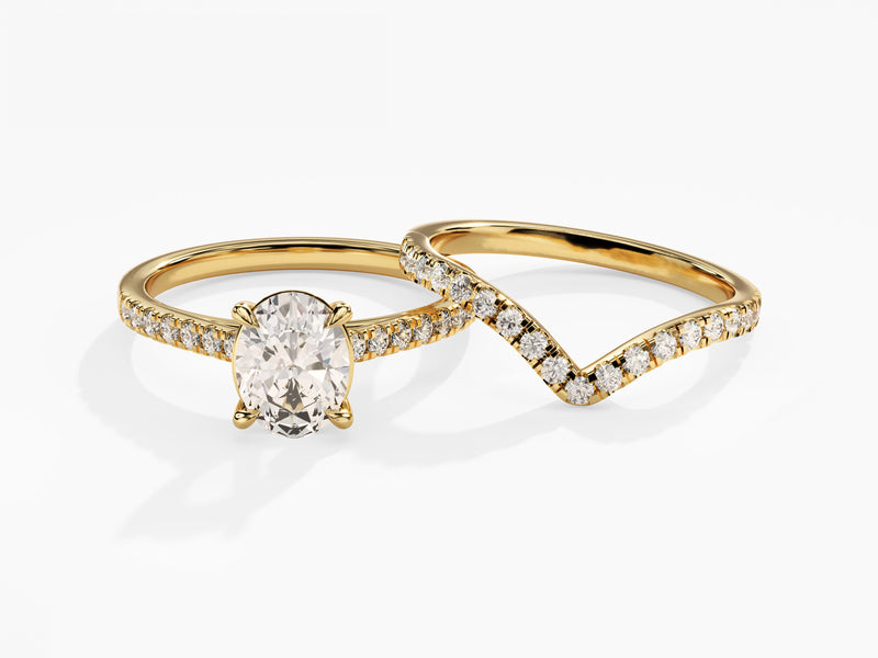 Gold oval diamond engagement ring with diamond wedding band
