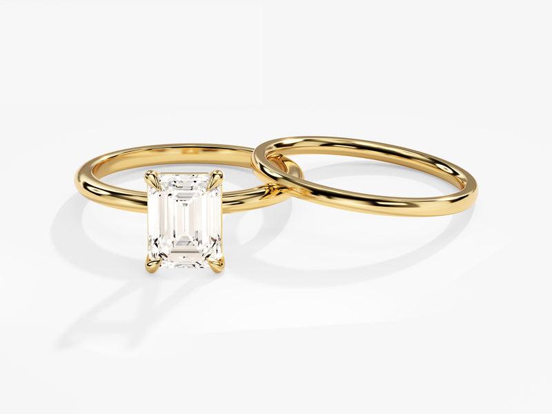 Emerald cut diamond engagement ring with gold band