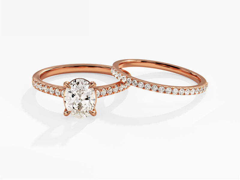 Rose gold oval diamond engagement ring set with wedding band