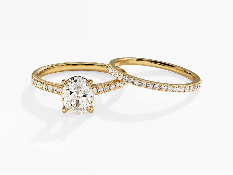 Gold oval diamond engagement ring and wedding band set