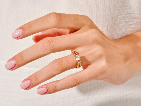 Gold diamond ring on a hand, jewelry product photography