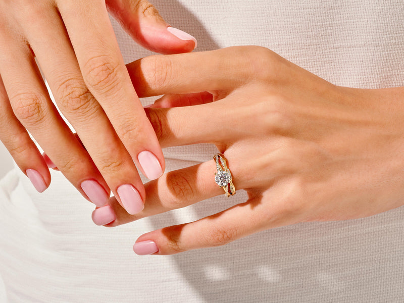 Diamond engagement ring on a woman's hand, fine jewelry