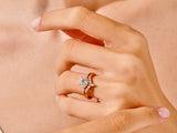 Diamond engagement ring set on a woman's hand