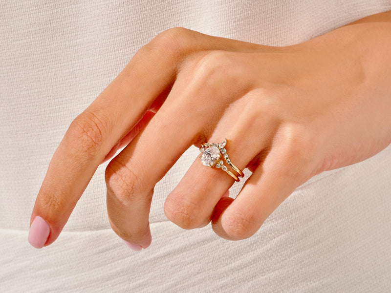 Gold diamond engagement ring set on a hand