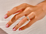 Diamond engagement ring on a woman's hand, jewelry product