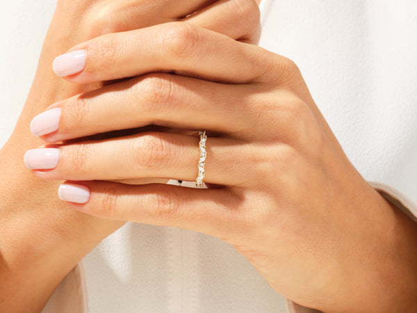 Diamond eternity ring on a woman's hand