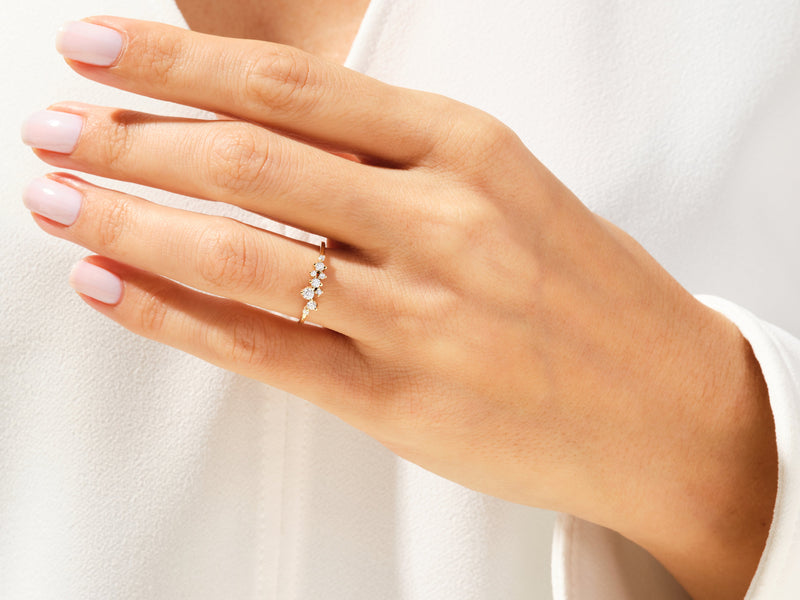 Diamond cluster ring on hand, fine jewelry, elegant design