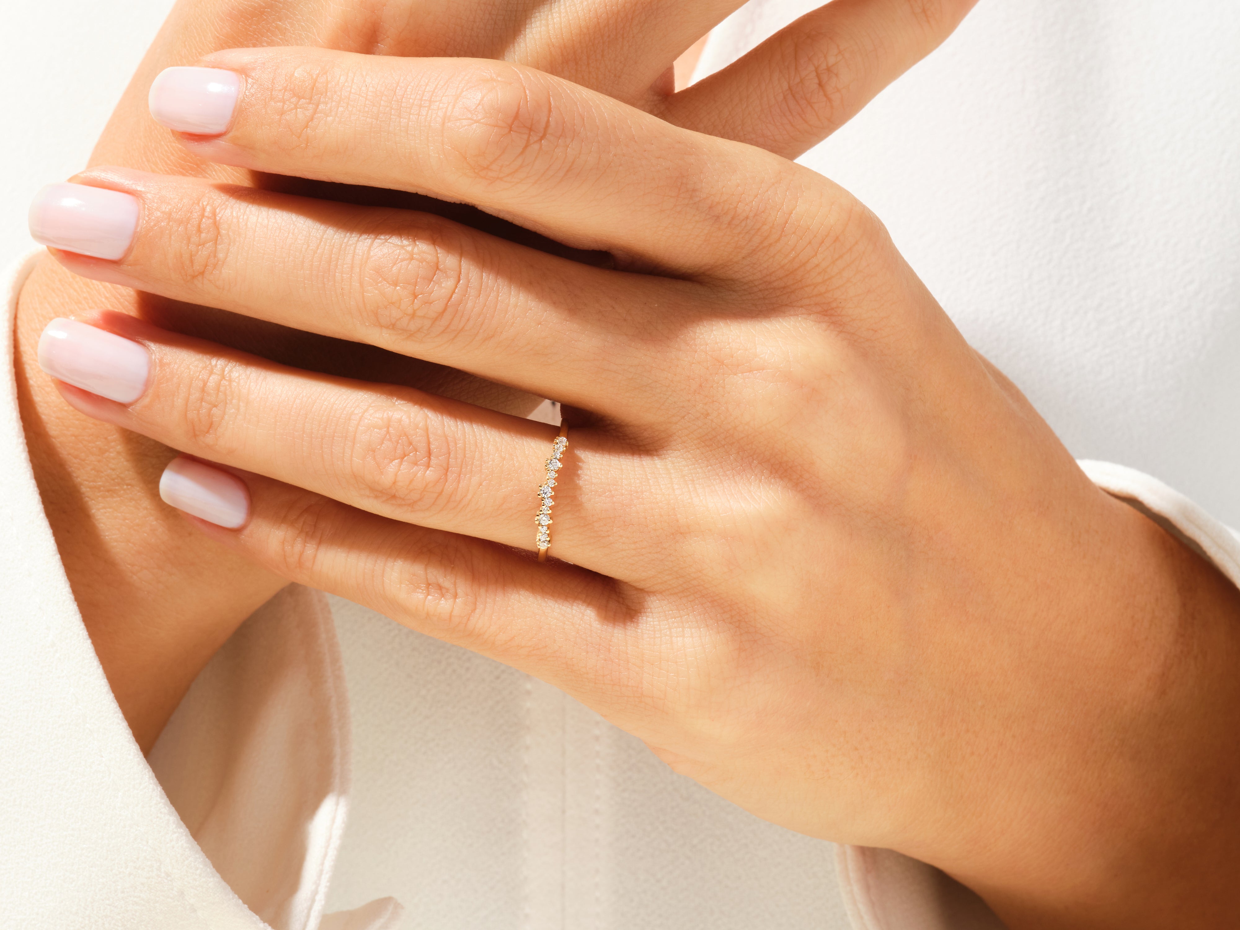 Diamond cluster ring on a woman's hand, fine jewelry