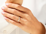 Diamond cluster ring on a woman's hand, jewelry photography