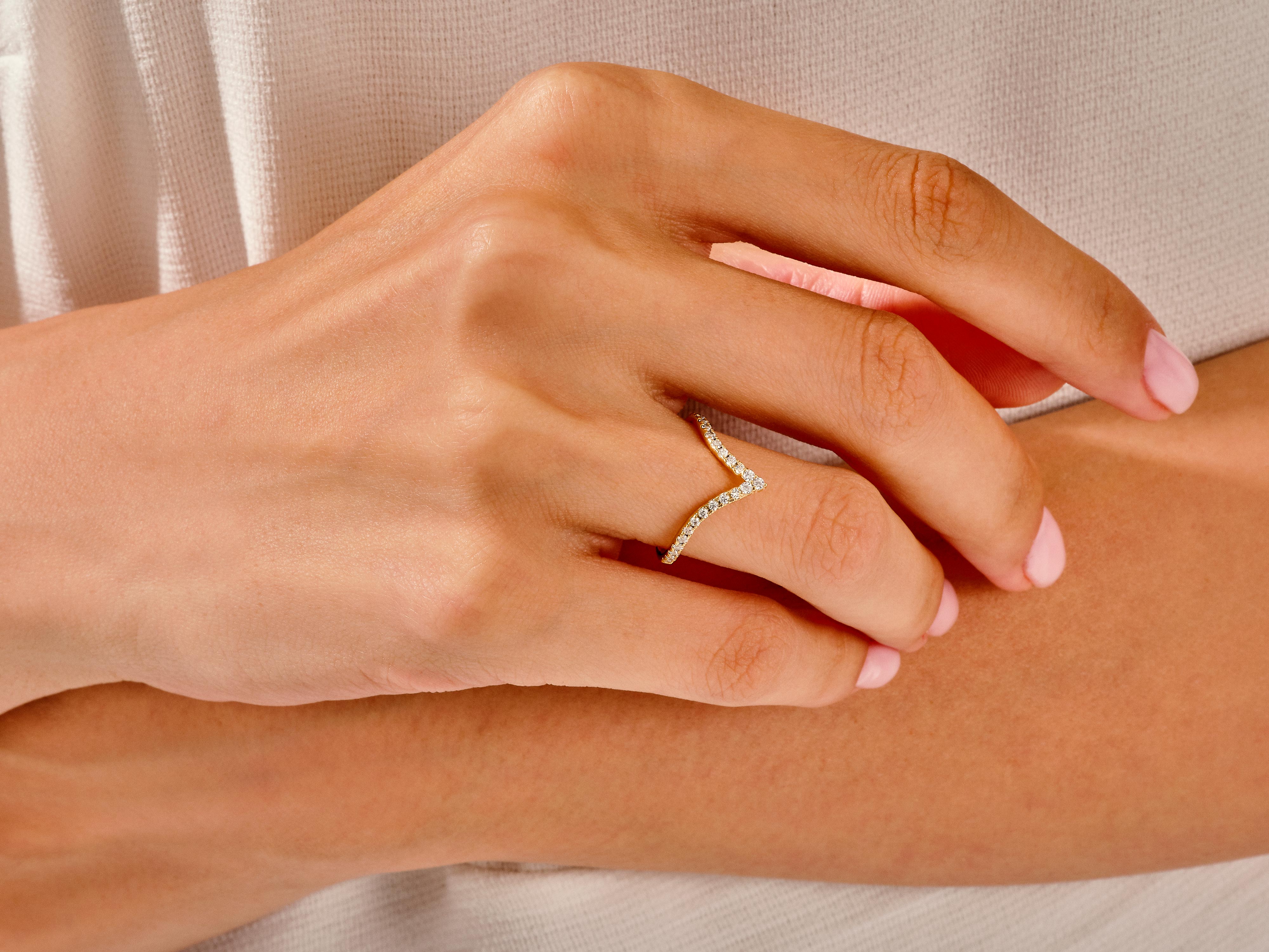 Diamond chevron ring on hand, fine jewelry, elegant design