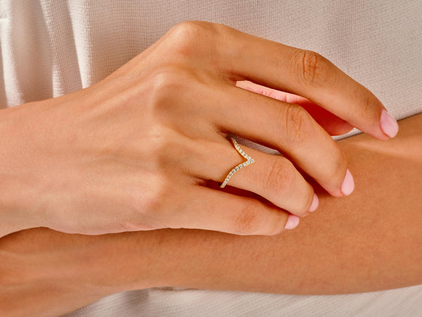 Diamond chevron ring on hand, fine jewelry