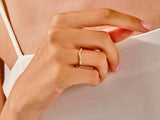 Diamond curved ring on a woman's finger, fine jewelry
