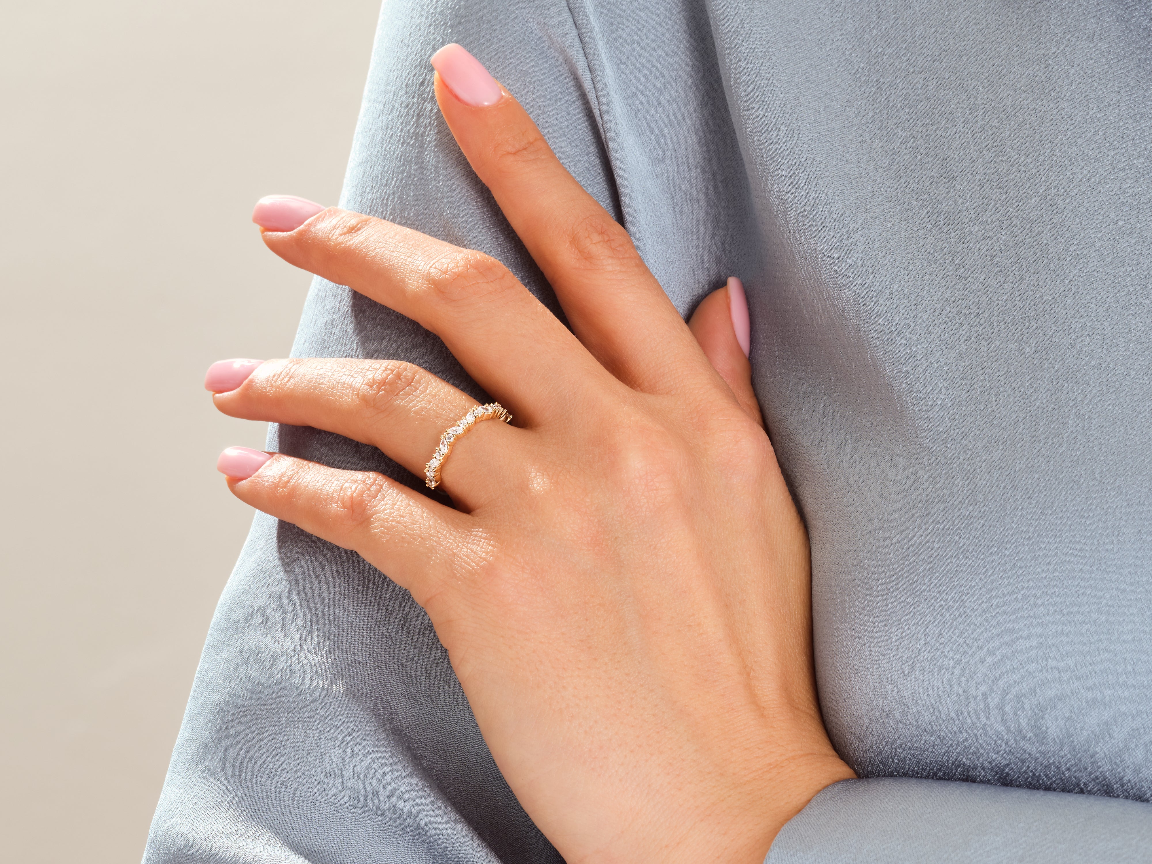 Gold diamond ring on a woman's hand