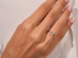 Oval diamond engagement ring on a woman's hand