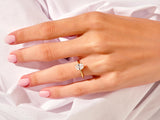 Oval diamond engagement ring on a woman's hand