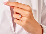 Emerald cut diamond ring on a woman's finger