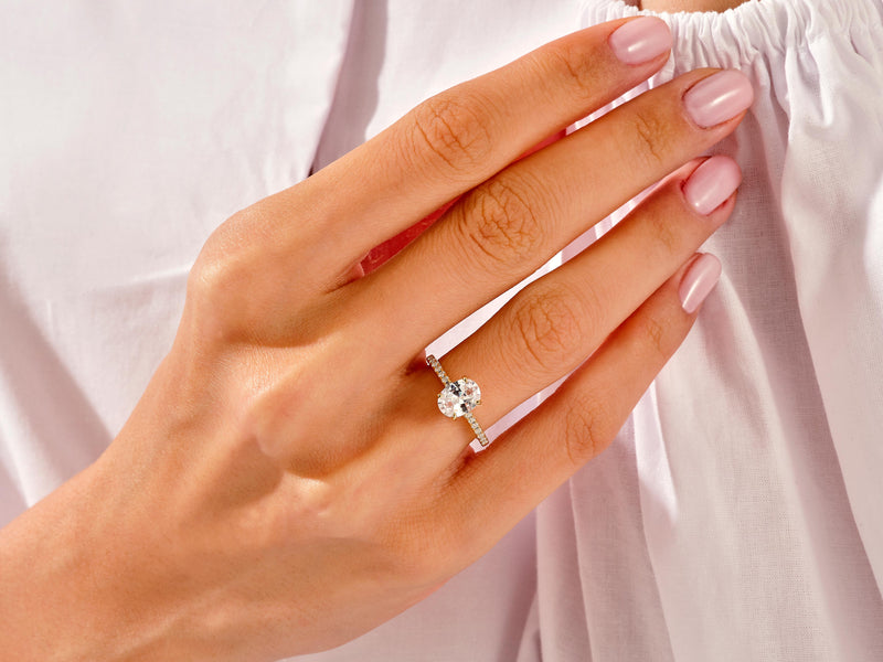 Diamond engagement ring on a woman's hand, jewelry photography