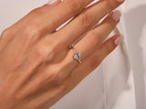 Oval diamond engagement ring on a hand