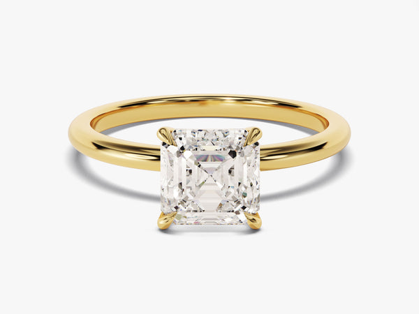 Gold ring with emerald-cut diamond engagement ring