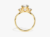 Gold three-stone diamond ring with pave band
