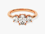 Rose gold three-stone diamond engagement ring