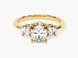 Gold three-stone oval diamond engagement ring