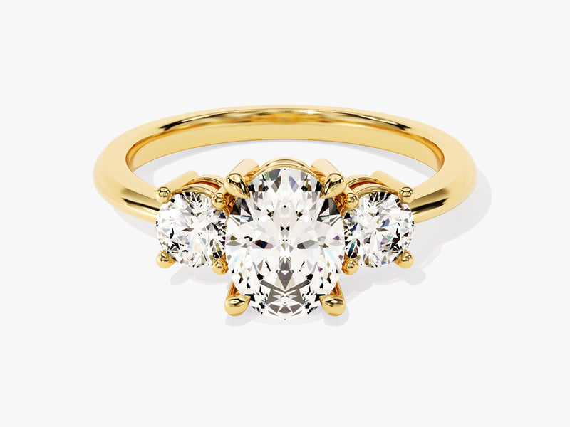 Gold three-stone oval diamond engagement ring