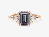 Emerald cut alexandrite ring with diamonds on rose gold band