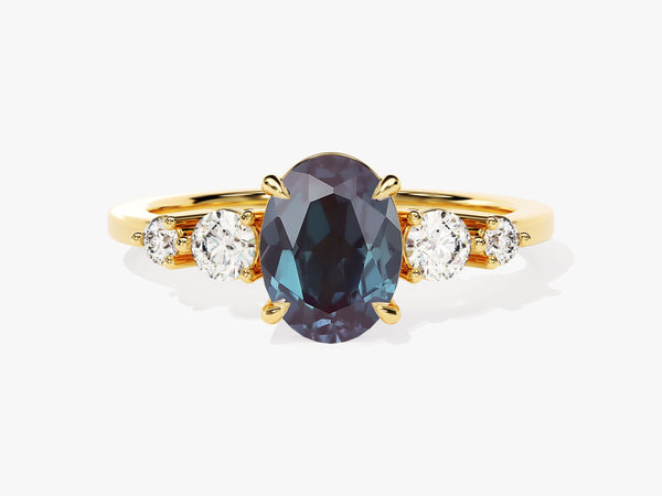 Oval alexandrite and diamond engagement ring in gold