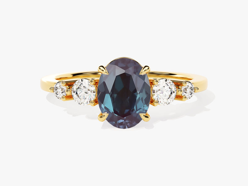 Oval alexandrite and diamond engagement ring in gold
