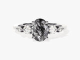 Oval rutilated quartz and diamond engagement ring